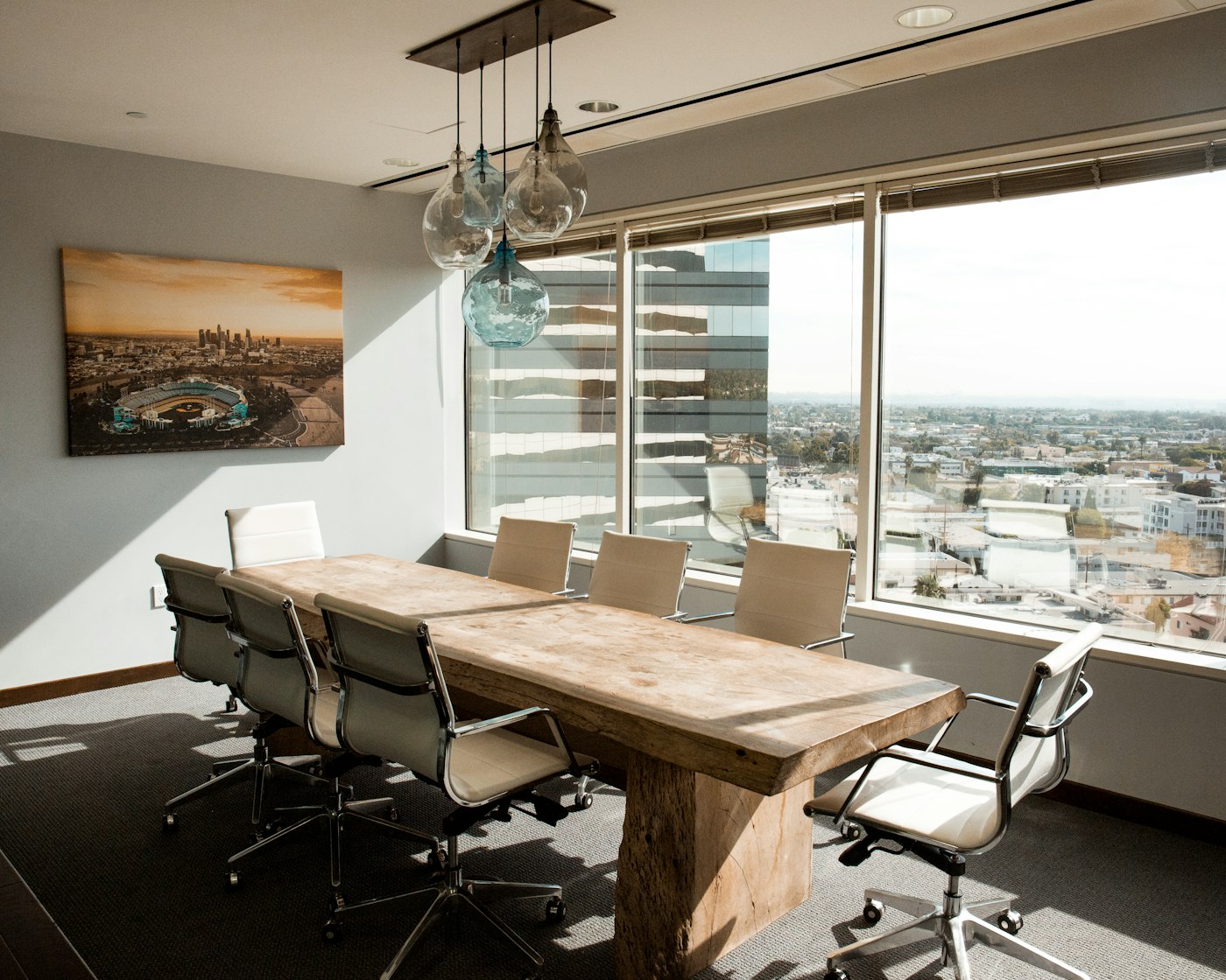Bright meeting room with large windows and natural daylight
